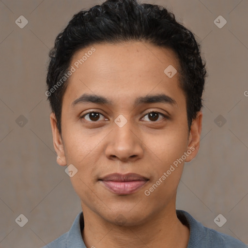 Joyful latino young-adult male with short  black hair and brown eyes