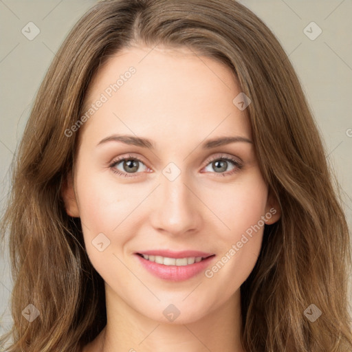 Joyful white young-adult female with long  brown hair and green eyes