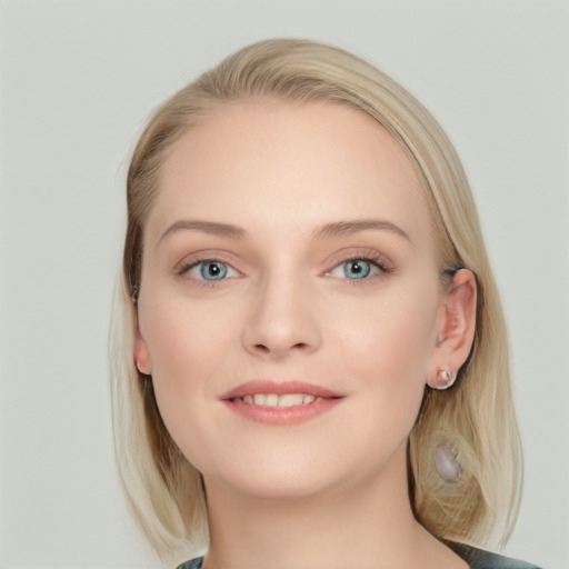 Joyful white young-adult female with long  brown hair and blue eyes