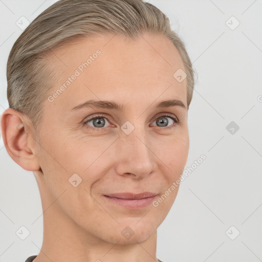 Joyful white adult female with short  brown hair and grey eyes