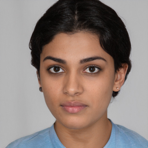 Neutral latino young-adult female with medium  black hair and brown eyes