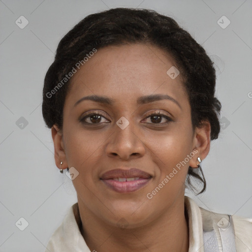 Joyful black young-adult female with short  brown hair and brown eyes