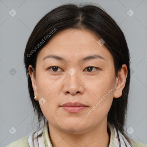 Joyful asian young-adult female with medium  brown hair and brown eyes