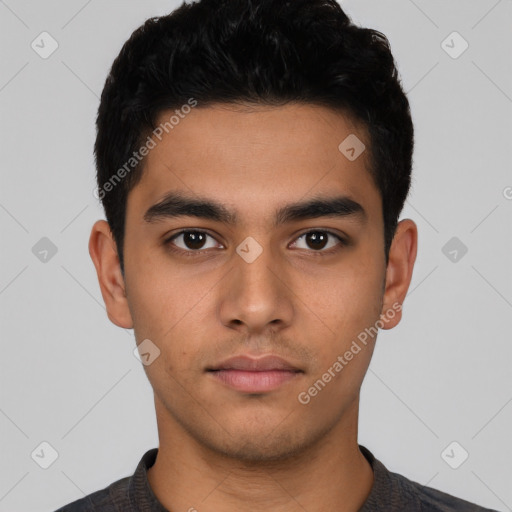 Neutral latino young-adult male with short  black hair and brown eyes