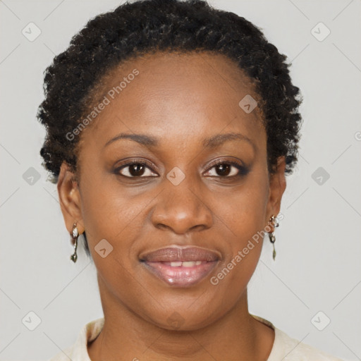 Joyful black adult female with short  brown hair and brown eyes