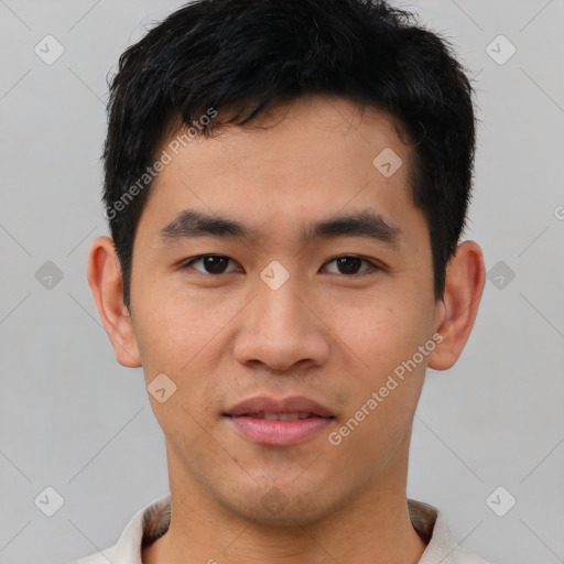 Joyful asian young-adult male with short  black hair and brown eyes