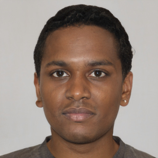 Neutral black young-adult male with short  black hair and brown eyes