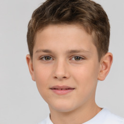 Joyful white child male with short  brown hair and brown eyes