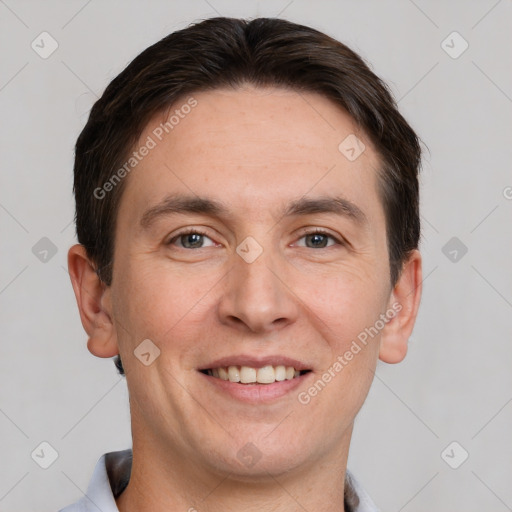 Joyful white adult male with short  brown hair and grey eyes