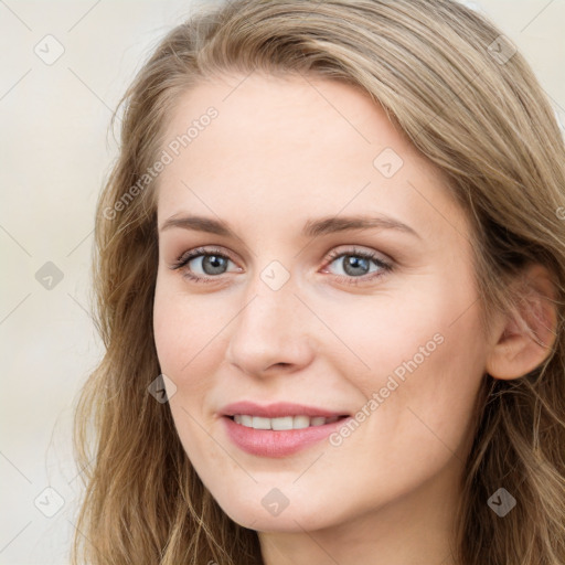 Joyful white young-adult female with long  brown hair and blue eyes