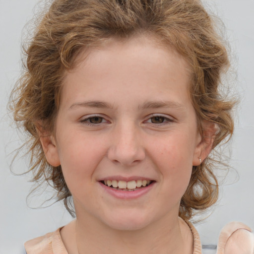 Joyful white child female with medium  brown hair and brown eyes