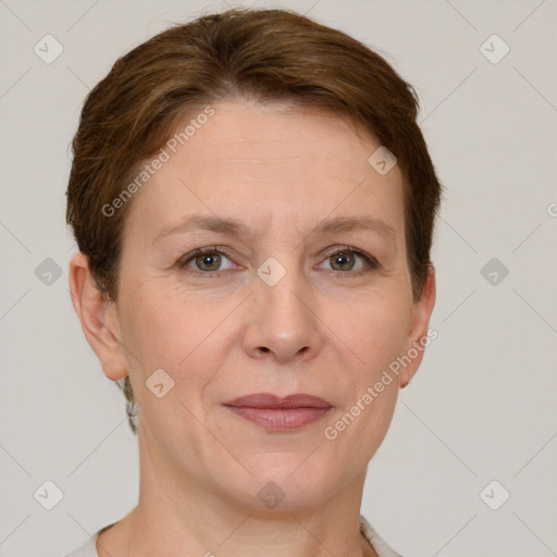 Joyful white adult female with short  brown hair and grey eyes