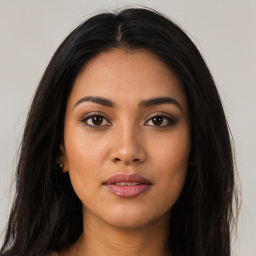 Neutral latino young-adult female with long  black hair and brown eyes