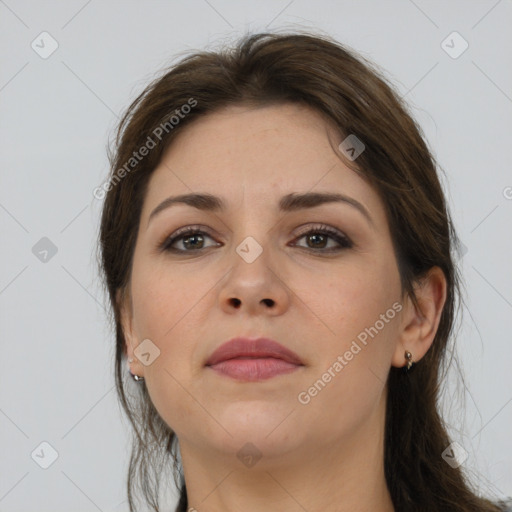 Neutral white young-adult female with long  brown hair and brown eyes