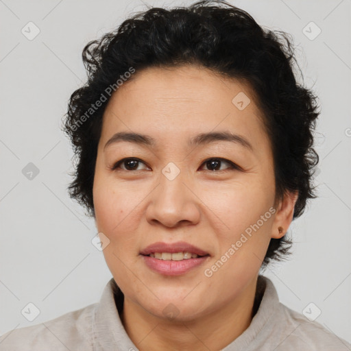 Joyful asian adult female with short  brown hair and brown eyes