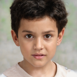 Joyful white child male with short  brown hair and brown eyes