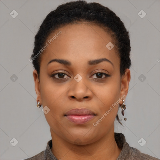 Joyful black young-adult female with short  brown hair and brown eyes