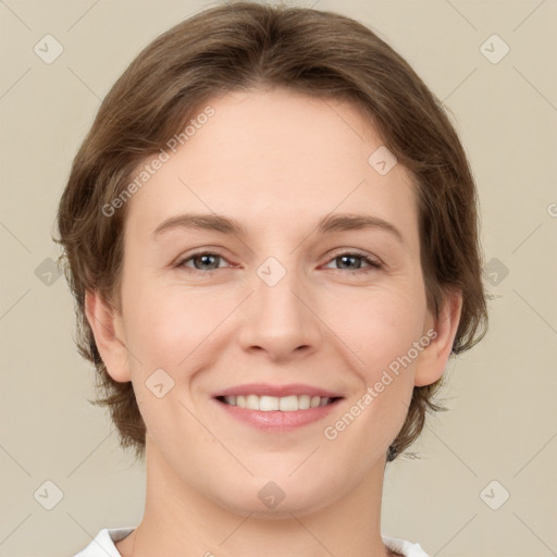 Joyful white young-adult female with medium  brown hair and grey eyes