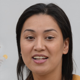 Joyful asian adult female with medium  brown hair and brown eyes