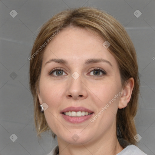 Joyful white young-adult female with medium  brown hair and grey eyes