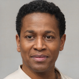 Joyful latino adult male with short  black hair and brown eyes