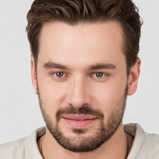 Joyful white young-adult male with short  brown hair and brown eyes