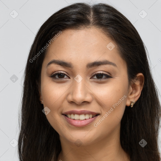 Joyful latino young-adult female with long  brown hair and brown eyes