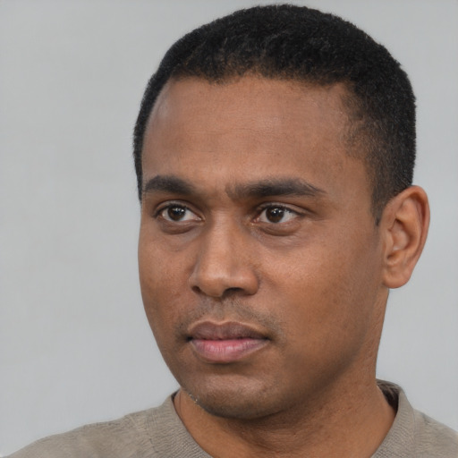 Neutral black young-adult male with short  black hair and brown eyes