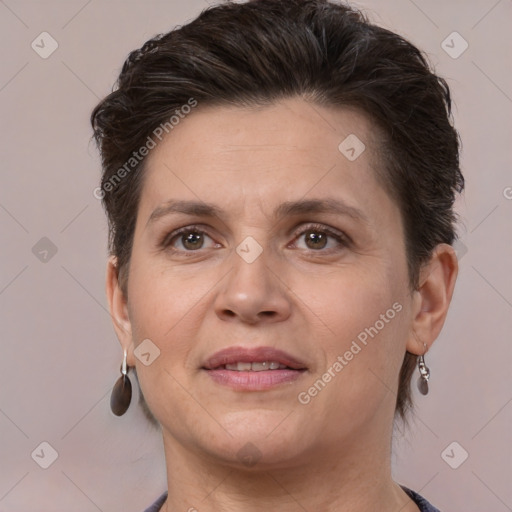 Joyful white adult female with short  brown hair and brown eyes