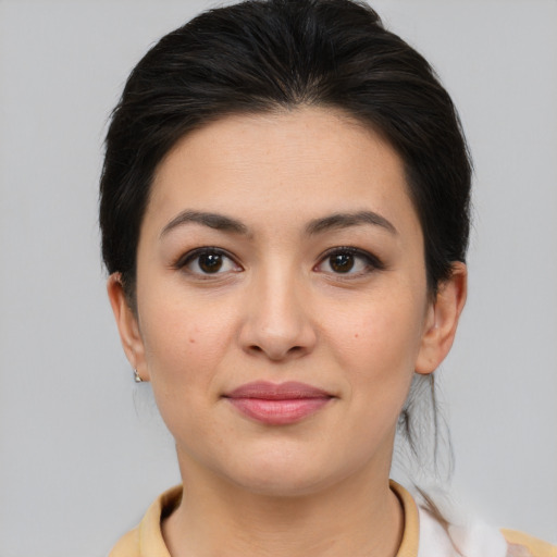 Joyful asian young-adult female with medium  brown hair and brown eyes