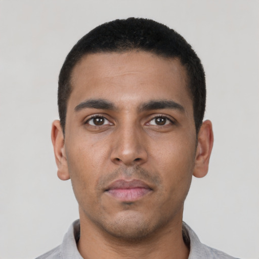 Neutral latino young-adult male with short  black hair and brown eyes