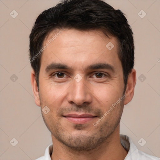 Joyful white young-adult male with short  black hair and brown eyes