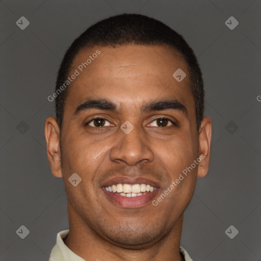 Joyful black young-adult male with short  brown hair and brown eyes