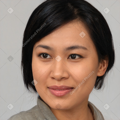 Joyful asian young-adult female with medium  black hair and brown eyes