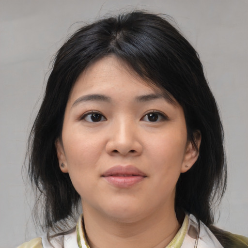 Neutral asian young-adult female with medium  brown hair and brown eyes
