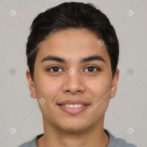 Joyful asian young-adult male with short  brown hair and brown eyes