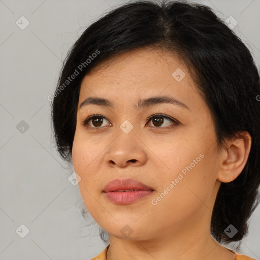 Joyful asian young-adult female with medium  brown hair and brown eyes