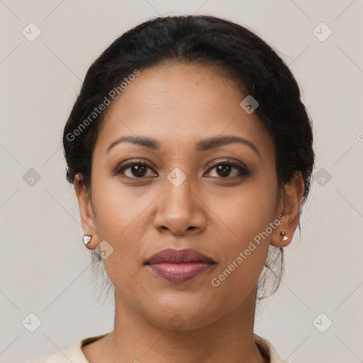 Joyful latino young-adult female with short  brown hair and brown eyes