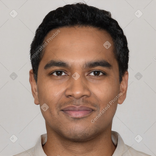 Joyful latino young-adult male with short  black hair and brown eyes