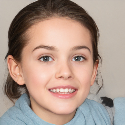 Joyful white child female with medium  brown hair and brown eyes