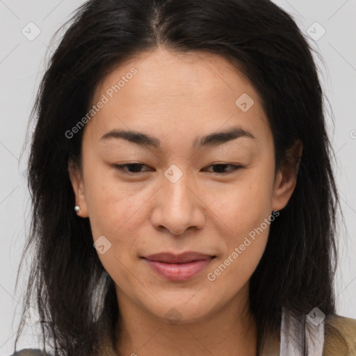 Joyful asian young-adult female with long  brown hair and brown eyes