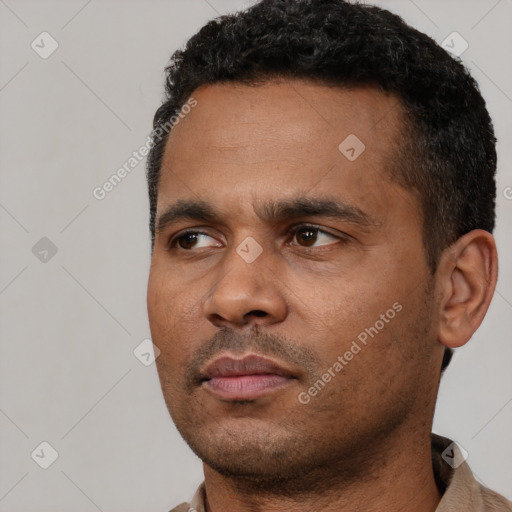 Neutral black young-adult male with short  black hair and brown eyes