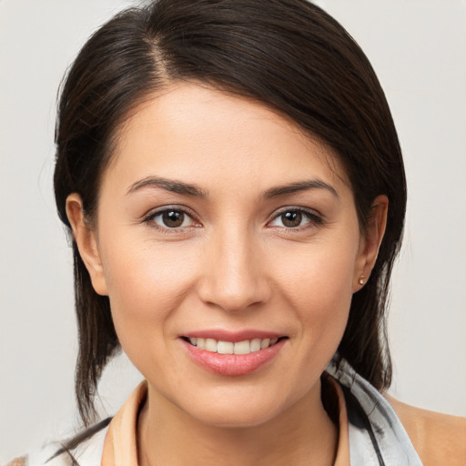 Joyful white young-adult female with medium  brown hair and brown eyes