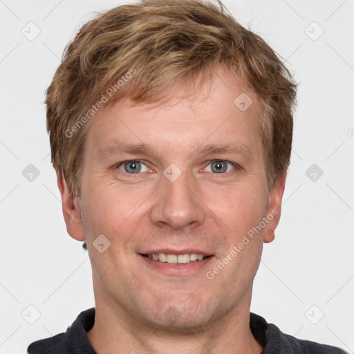 Joyful white adult male with short  brown hair and grey eyes