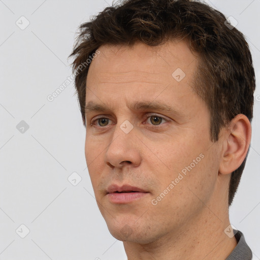 Neutral white adult male with short  brown hair and brown eyes