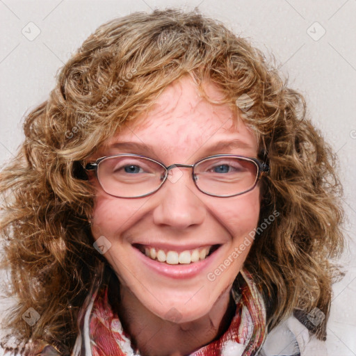 Joyful white adult female with medium  brown hair and blue eyes