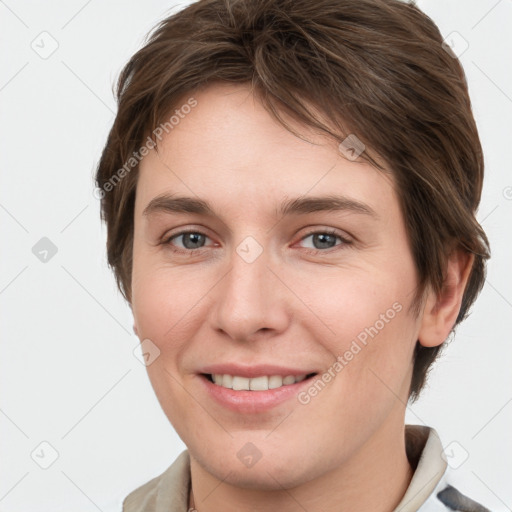 Joyful white young-adult female with short  brown hair and grey eyes