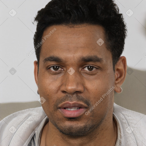Joyful black young-adult male with short  black hair and brown eyes