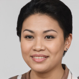 Joyful asian young-adult female with short  brown hair and brown eyes