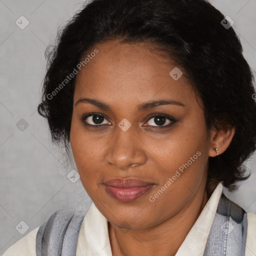 Joyful black adult female with medium  brown hair and brown eyes